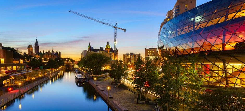 A view of Ottawa, Ontario's downtown over the Canal at dusk.
