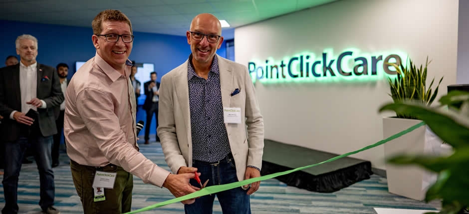 Mike Wessinger cutting the ribbon at the opening of PointClickCare's new downtown office