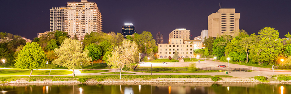 The skyline of London, Ontario at night as seen from the Thames River