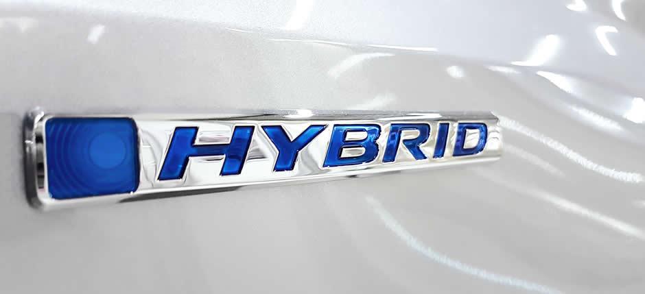 Hybrid badge on a vehicle